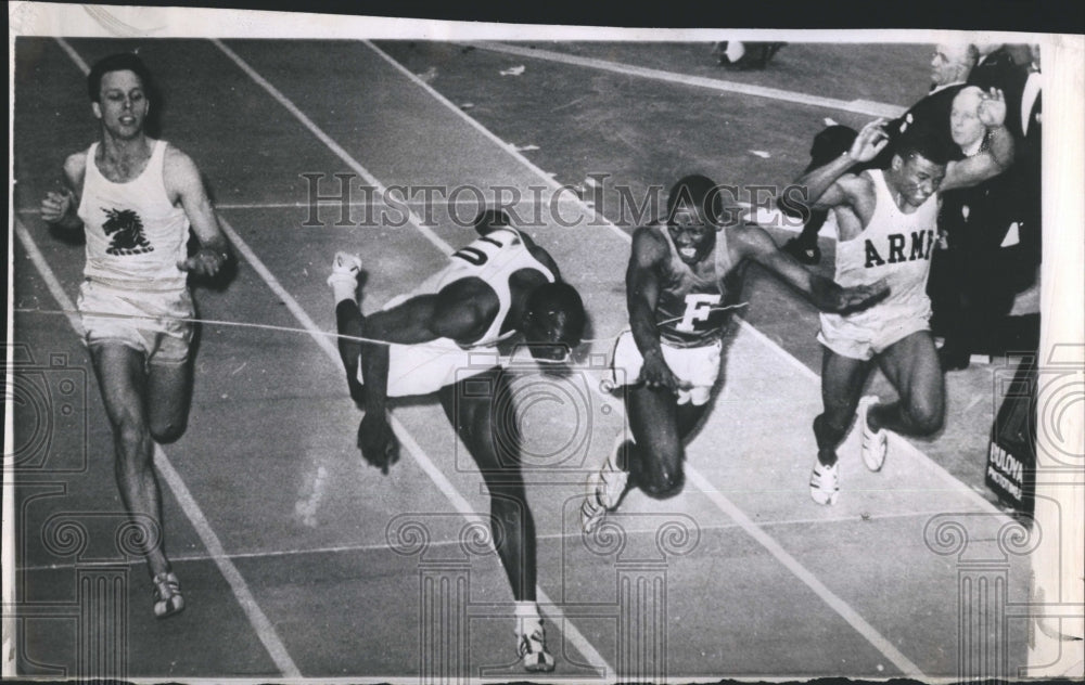 1964 Robert Hayes of Florida hits the tape with his nose. - Historic Images