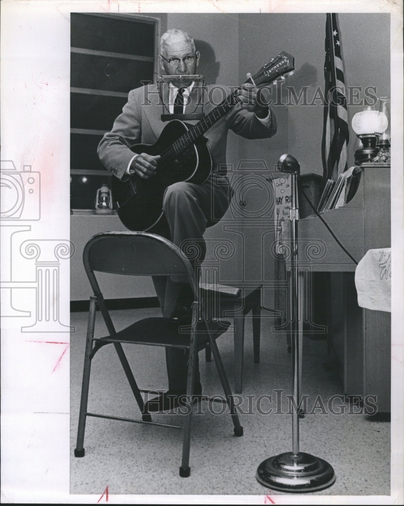 1963 Pastor William Munk playing guitar-Historic Images