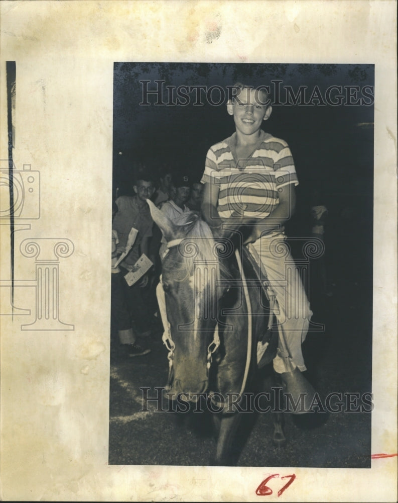 1961 Press Photo Doug Philpot sits as Pony. - Historic Images