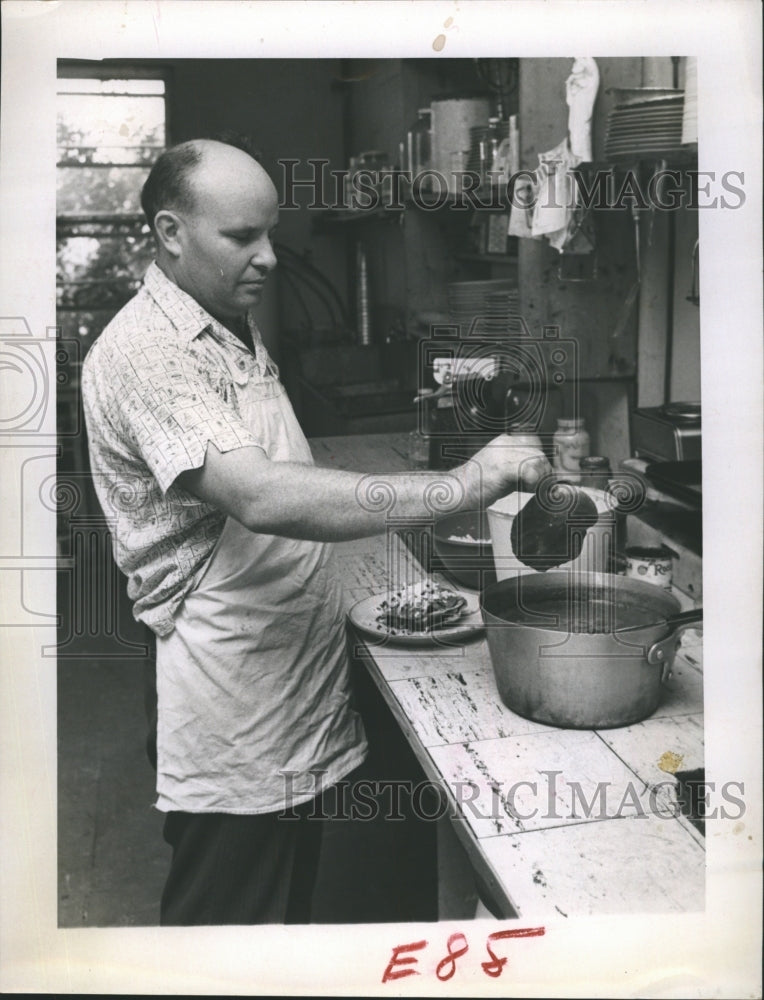 1962 Joseph Foster preparing Mexican dish  - Historic Images