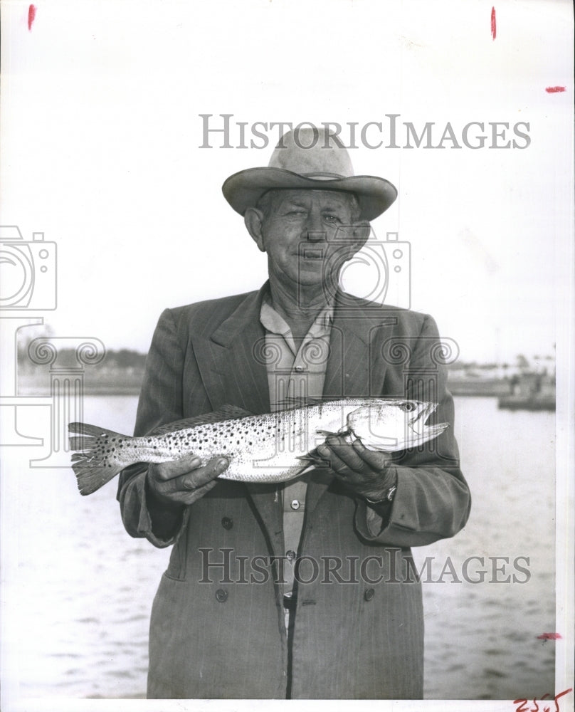 Press Photo Fisherman Clarence Luster catches a 5 pound trout in Florida - Historic Images