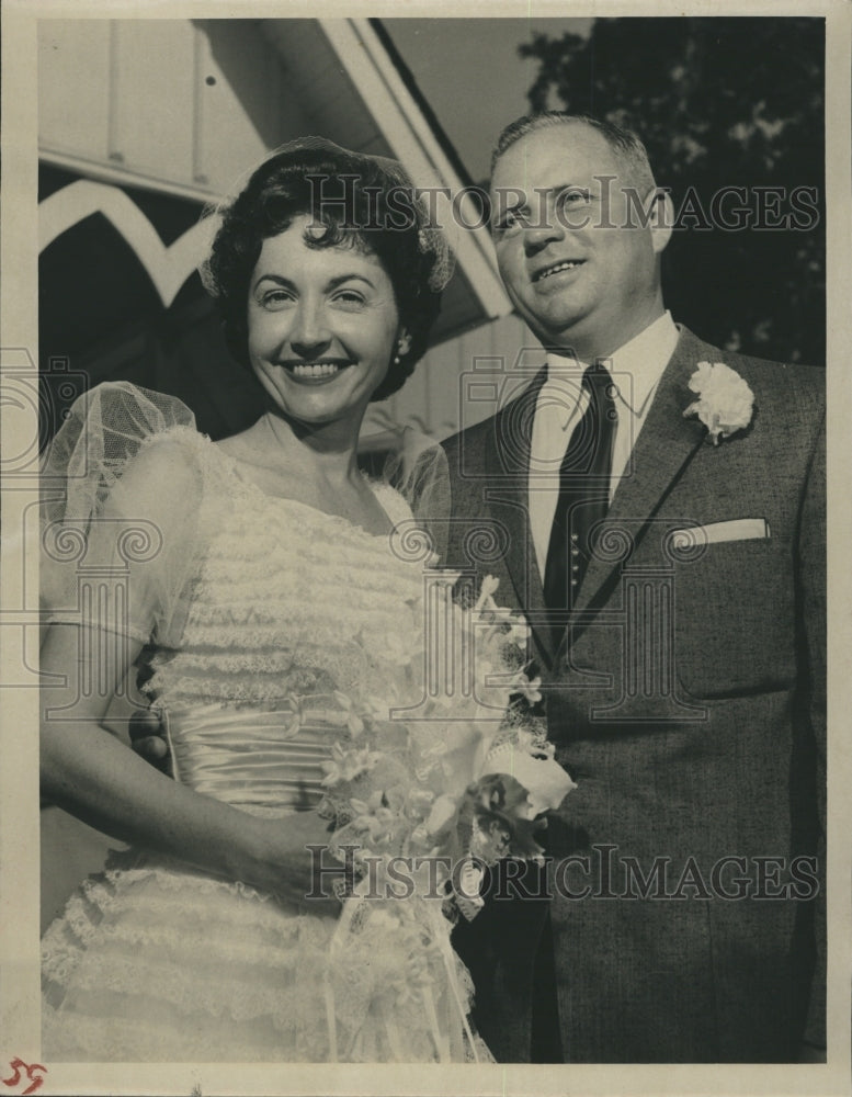 1957 Mr. and Mrs. Francis Sutton at their wedding.  - Historic Images