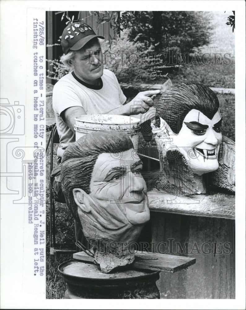 1985 Sculptor T.J Neil in finishing touch on head of Dracula. - Historic Images