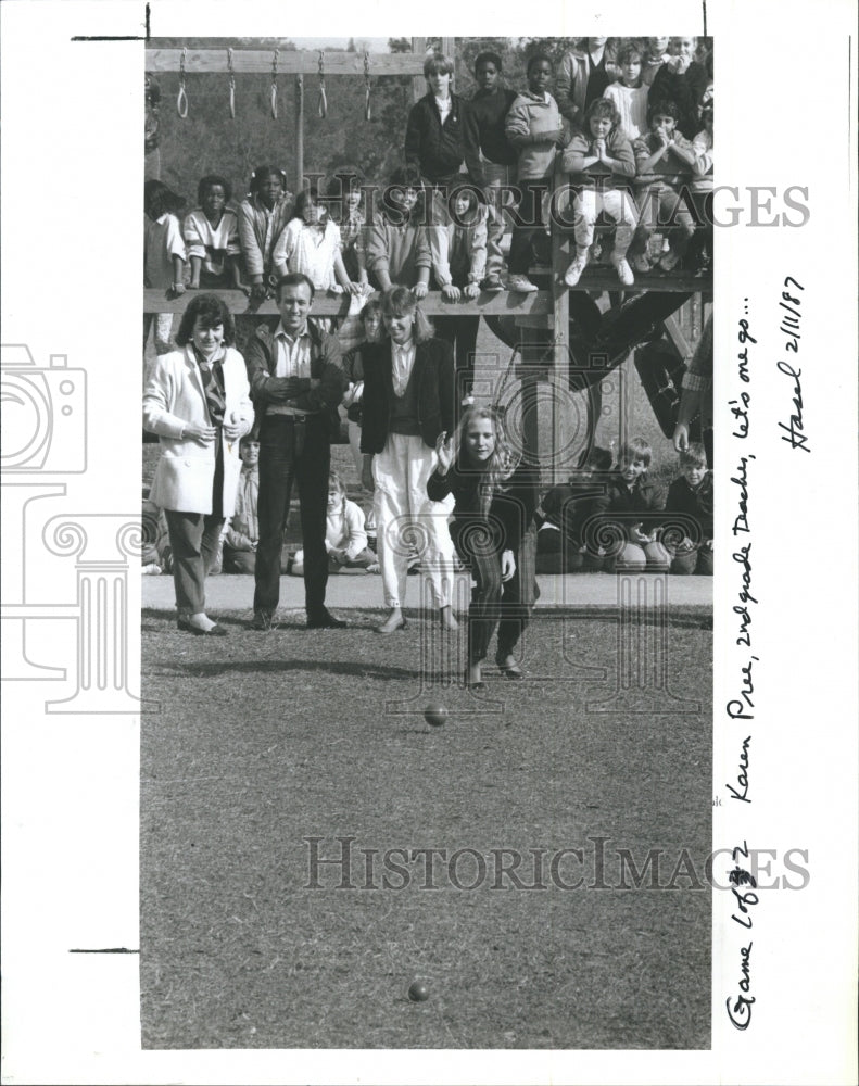 1987 Teacher Karen Pree rolls a boccie ball - Historic Images