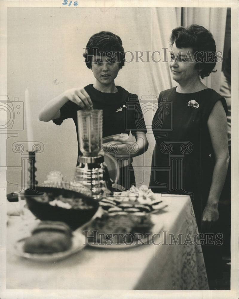 1964 Gail Marks, cooking - Historic Images