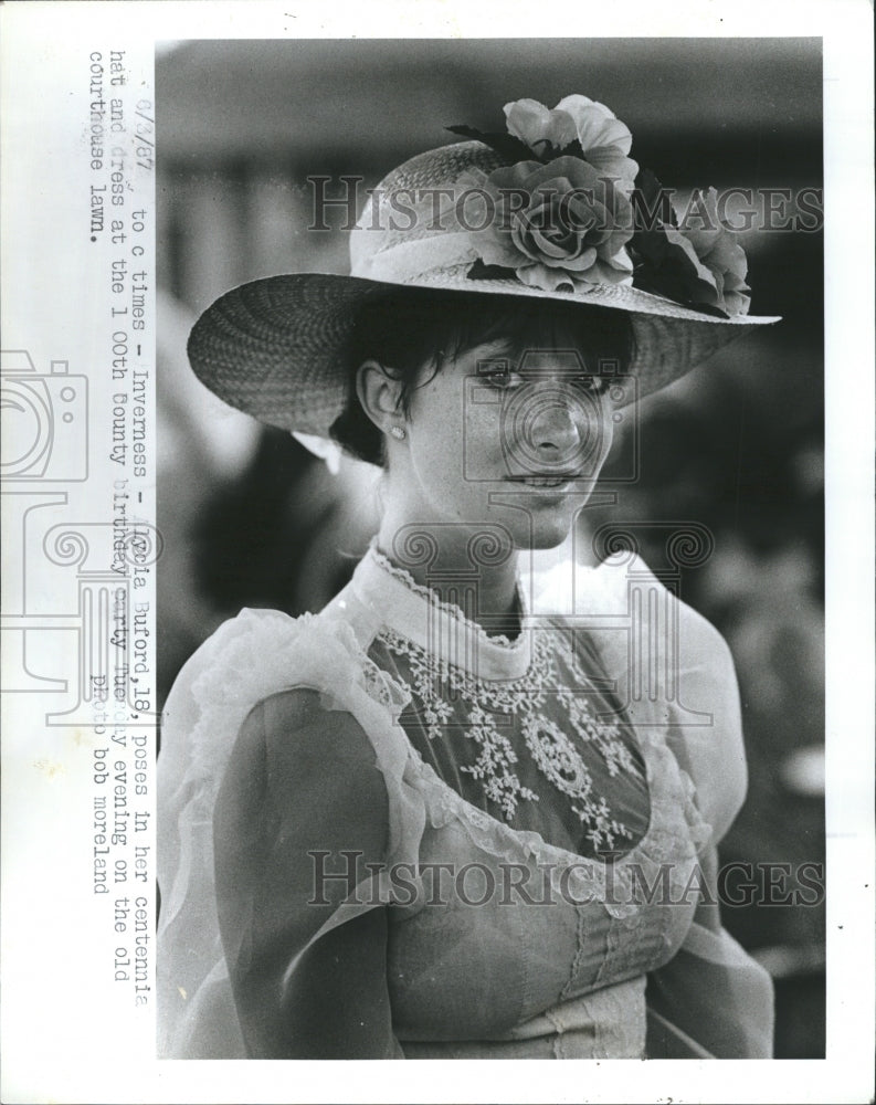 1987 Lycia Buford poses in her centennial hat and dress at 100th - Historic Images