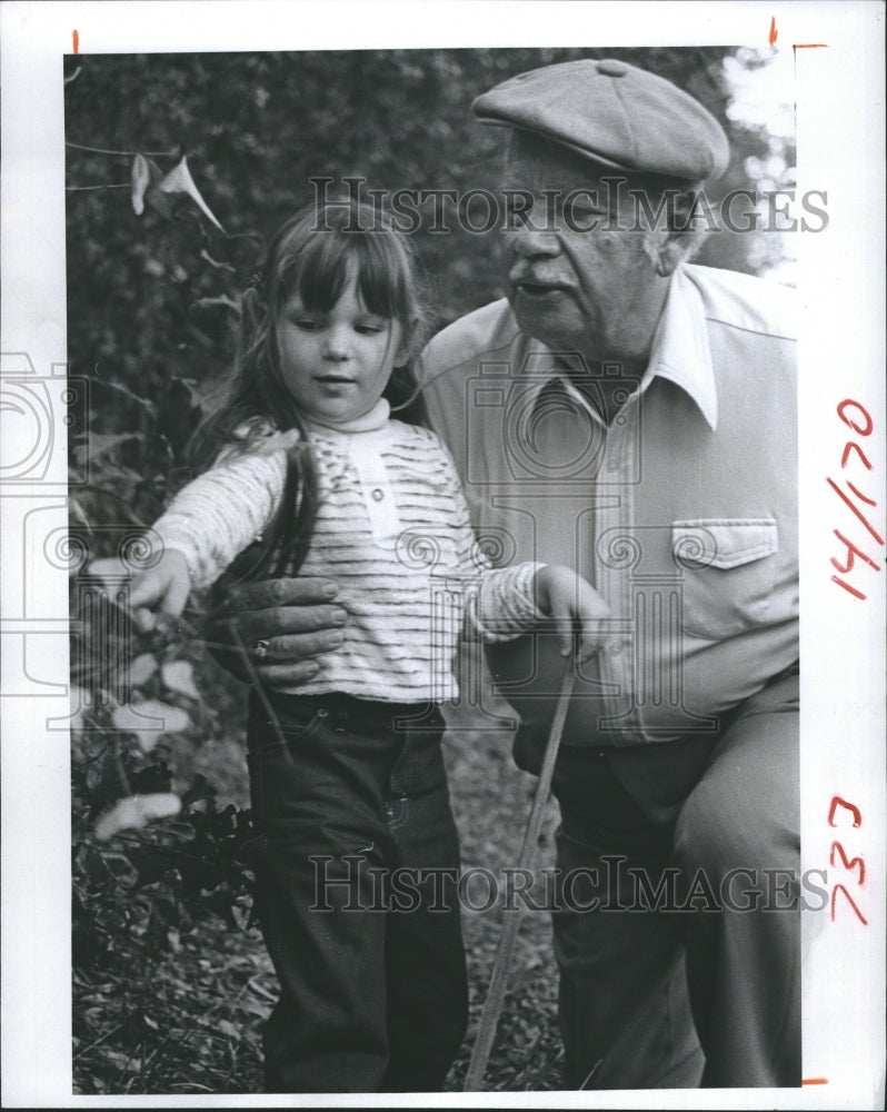 1981 Audrey Newlin and grandfather William Newlin walking in the - Historic Images