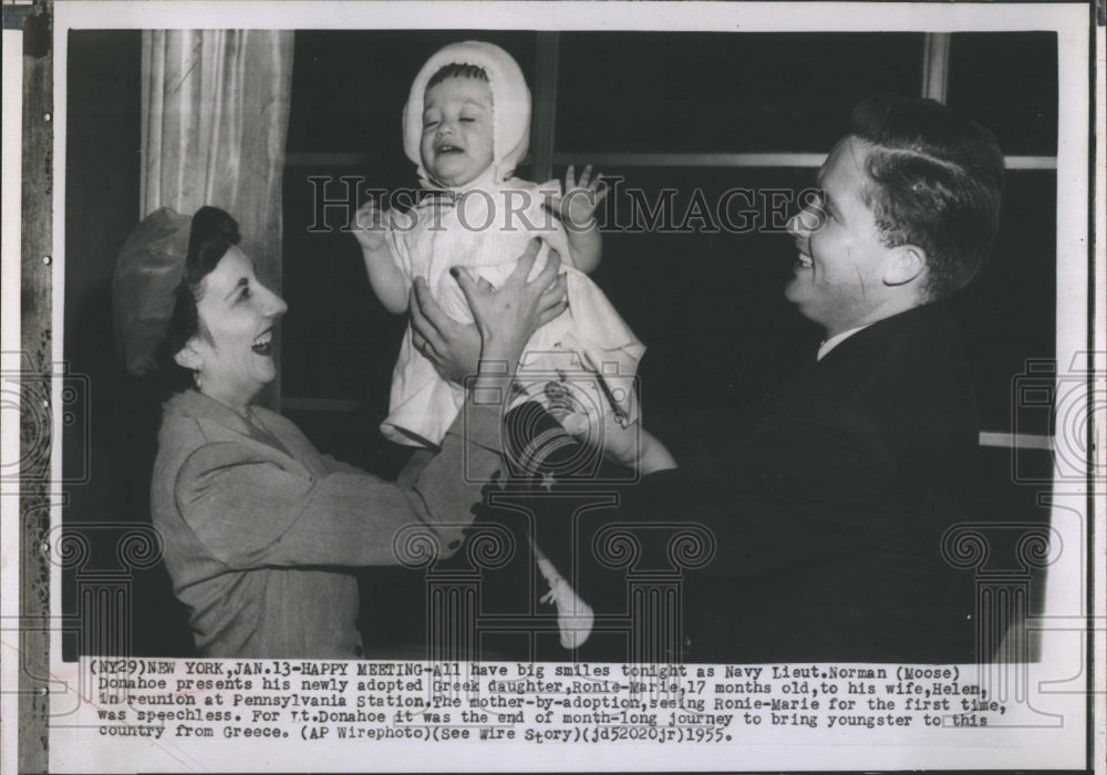 1955 Navy Lieut. Norman Moose presents his newly adopted daughter - Historic Images