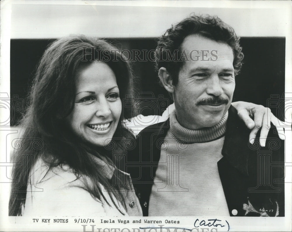 1974 Actor Warren Oates poses with Isela Vega.  - Historic Images