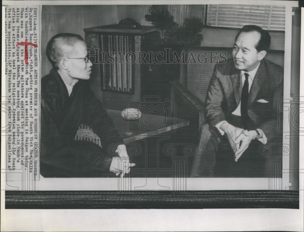 1964 Dr. Nguyen Xuan Oahn(right) talking with Thich Tan Chau. - Historic Images