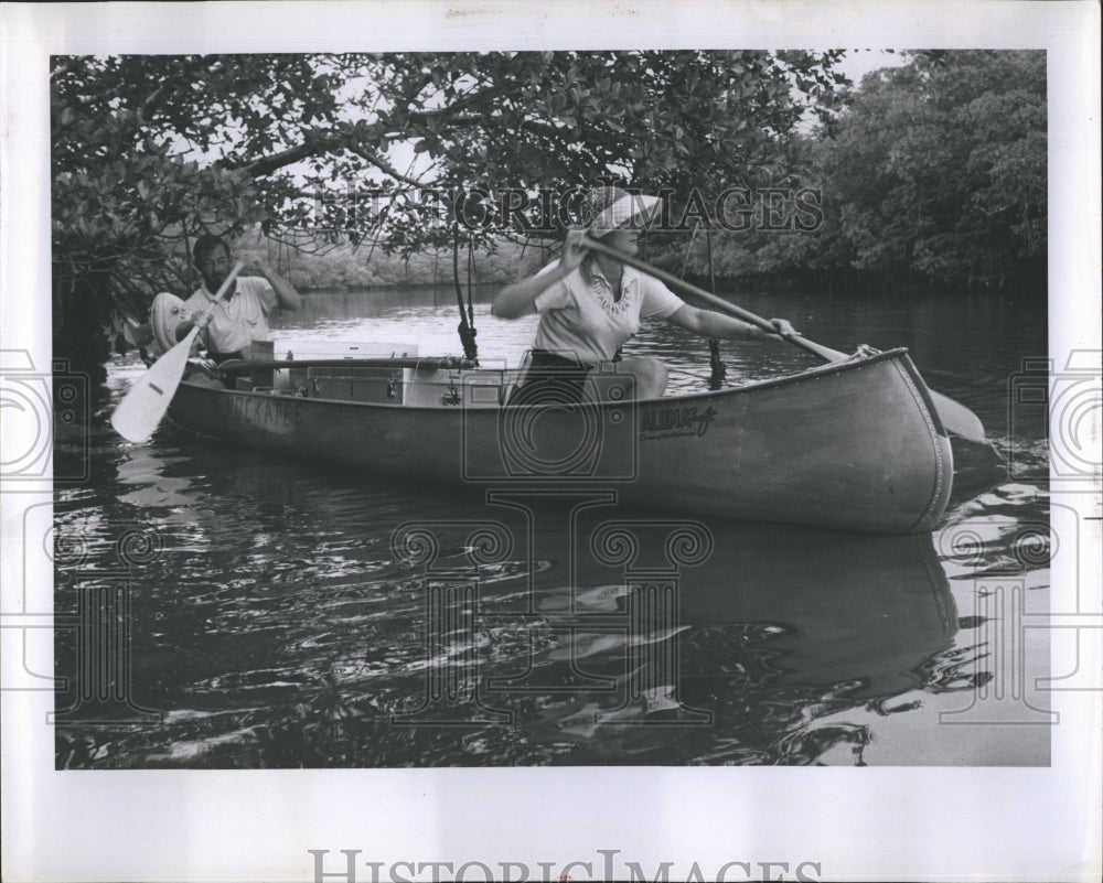 1936 Couple canoeing down river - Historic Images