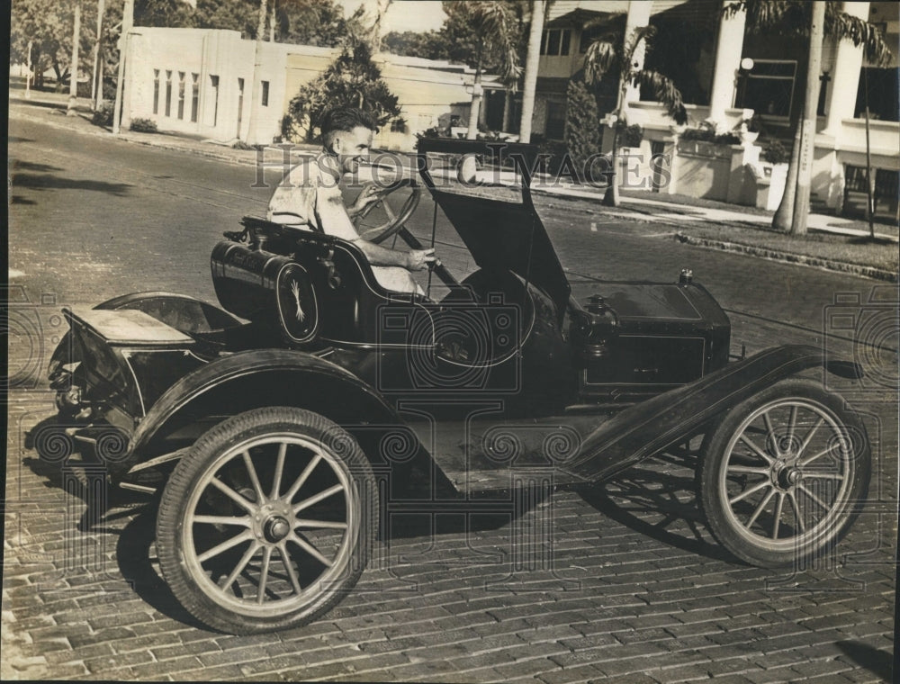 1940 Man Driving Car. - Historic Images