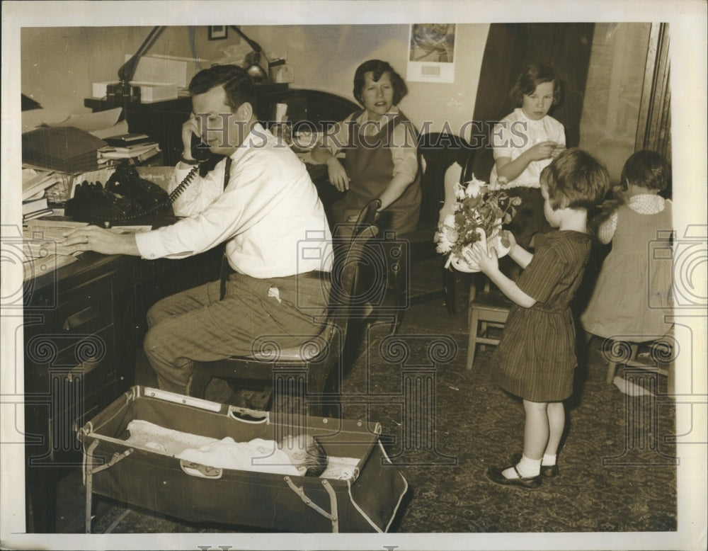 1963 Donald Fraser surrounded by distaff members  - Historic Images