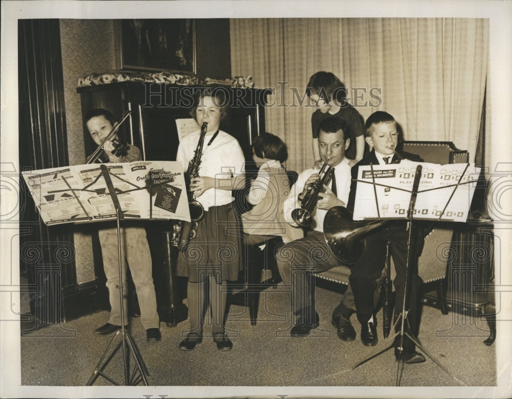 1963 Congressman Donal M. Fraser plays music with his 6 children - Historic Images