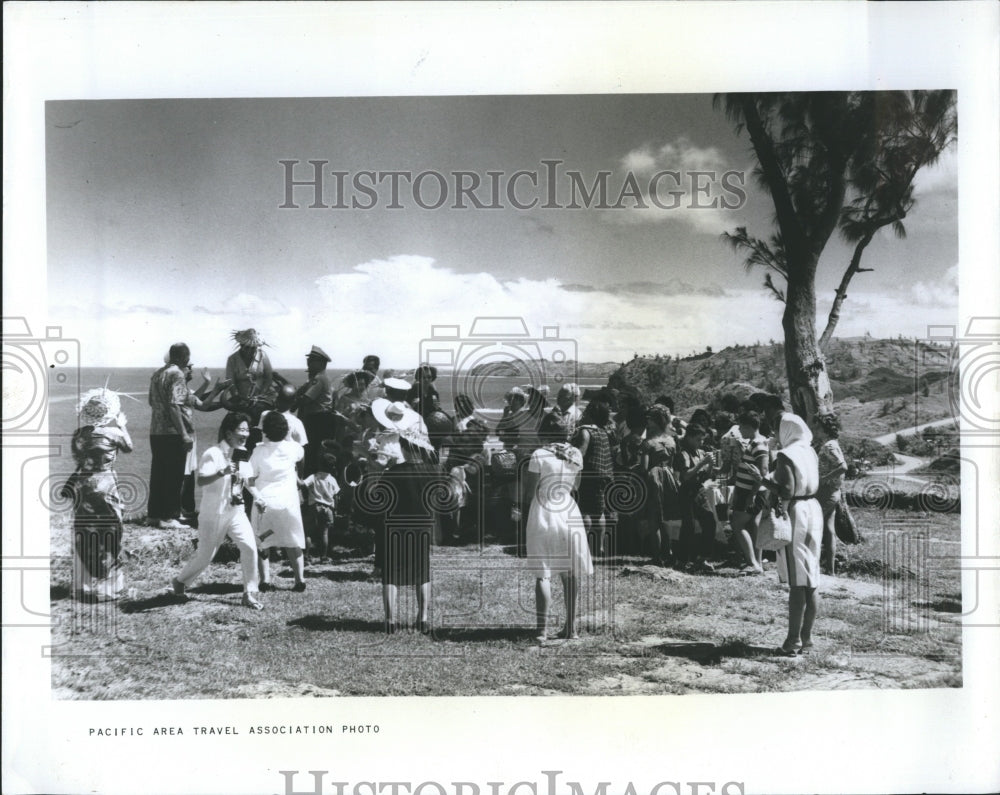 1965 Tourists riding water buffalo near Agana, Guam.  - Historic Images