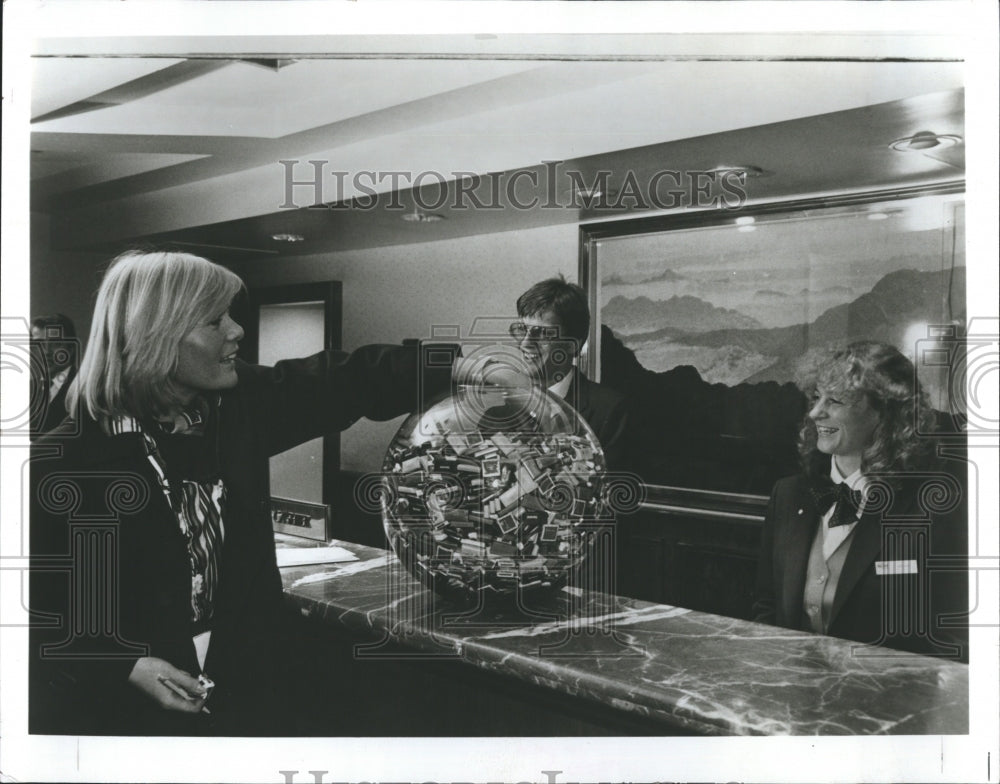 1965 New York Drake Hotel guests dip for swiss chocolate. - Historic Images