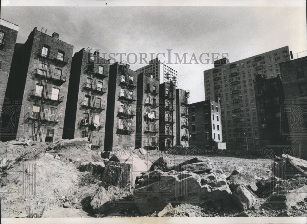 1975 Vacant lot and boarded tenements in New York City. - Historic Images