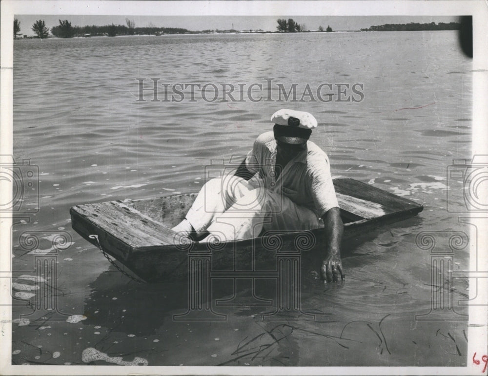 1957 Man in Boat.  - Historic Images