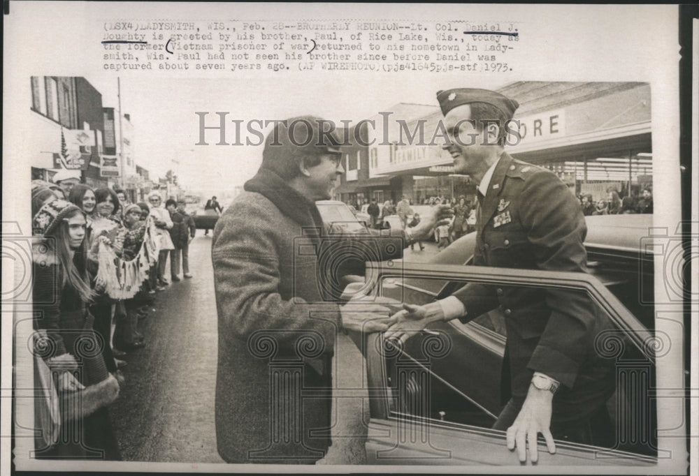 1973 Col.Daniel Doughty greeted by his brother.  - Historic Images