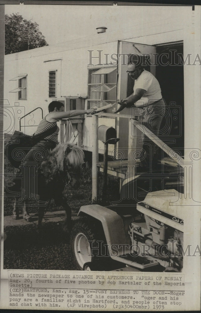1973 Roger and Flicka Deliver Papers  - Historic Images