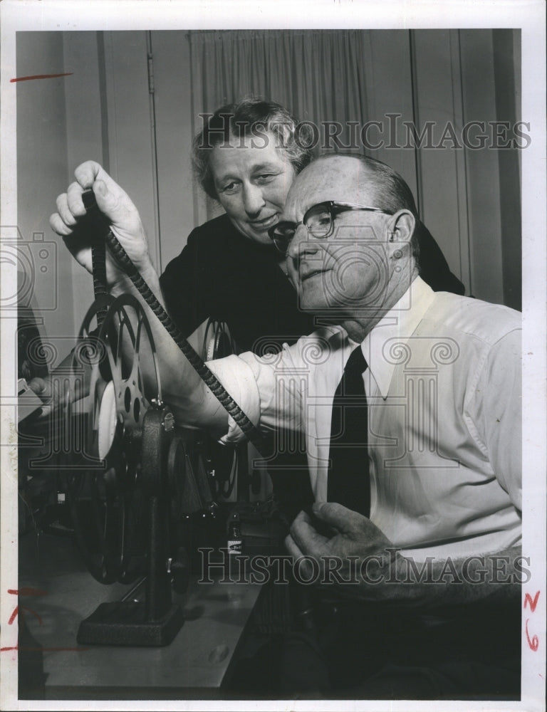 1956 Rev. and Mrs. R. V. Reynolds check film taken in Mau Mau. - Historic Images