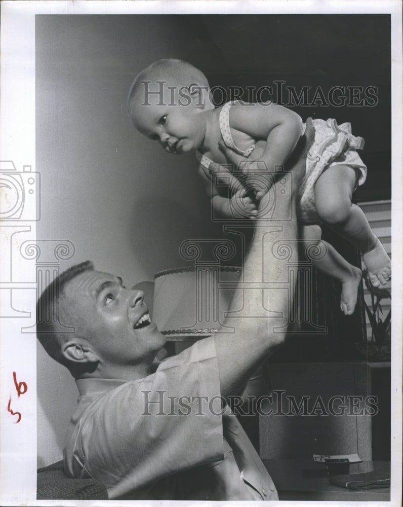 1959 Captain Rice with daughter. - Historic Images