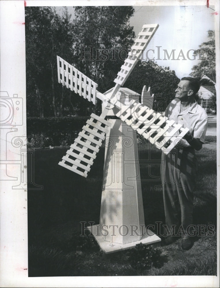 1969 Floyd Ricer shows off his miniature Dutch windmill in his - Historic Images
