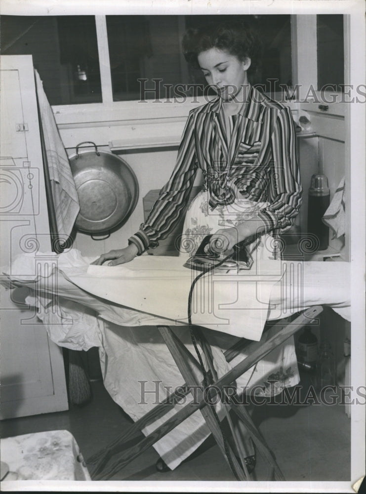 1951 Young Romanian woman preparing to enter college in US. - Historic Images