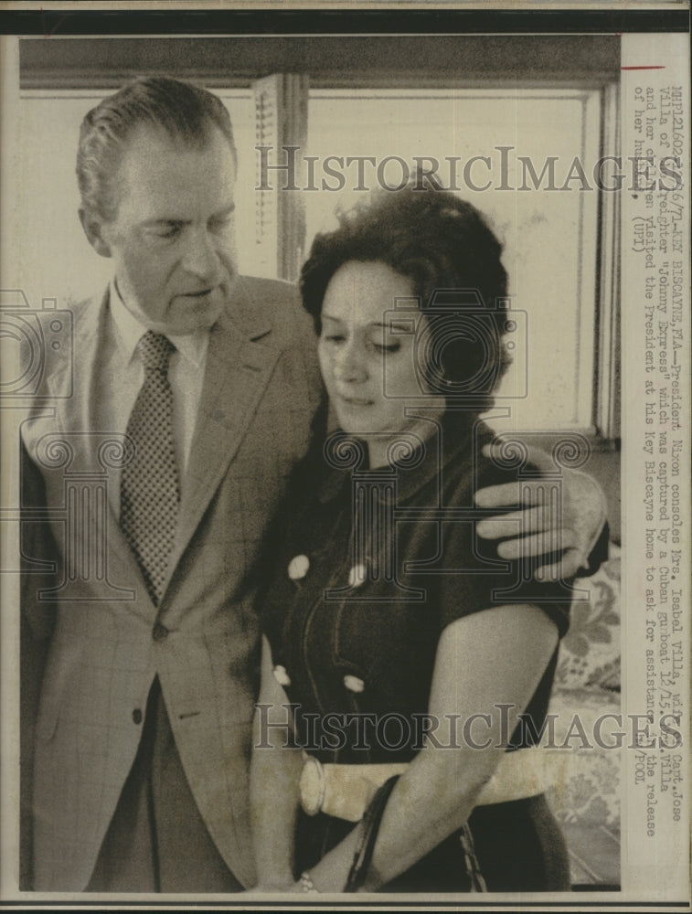 1971 Pres Nixon consoles Mrs. Isabel Villa, wife of Capt. Jose Villa - Historic Images