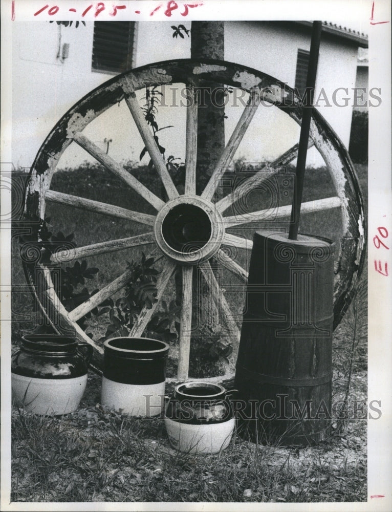 1972 Antiques, a wagon wheel, a wooden butter churn - Historic Images