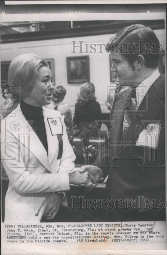 1972 State Senator John T. Ware greets Mrs. Lori Wilson. - Historic Images