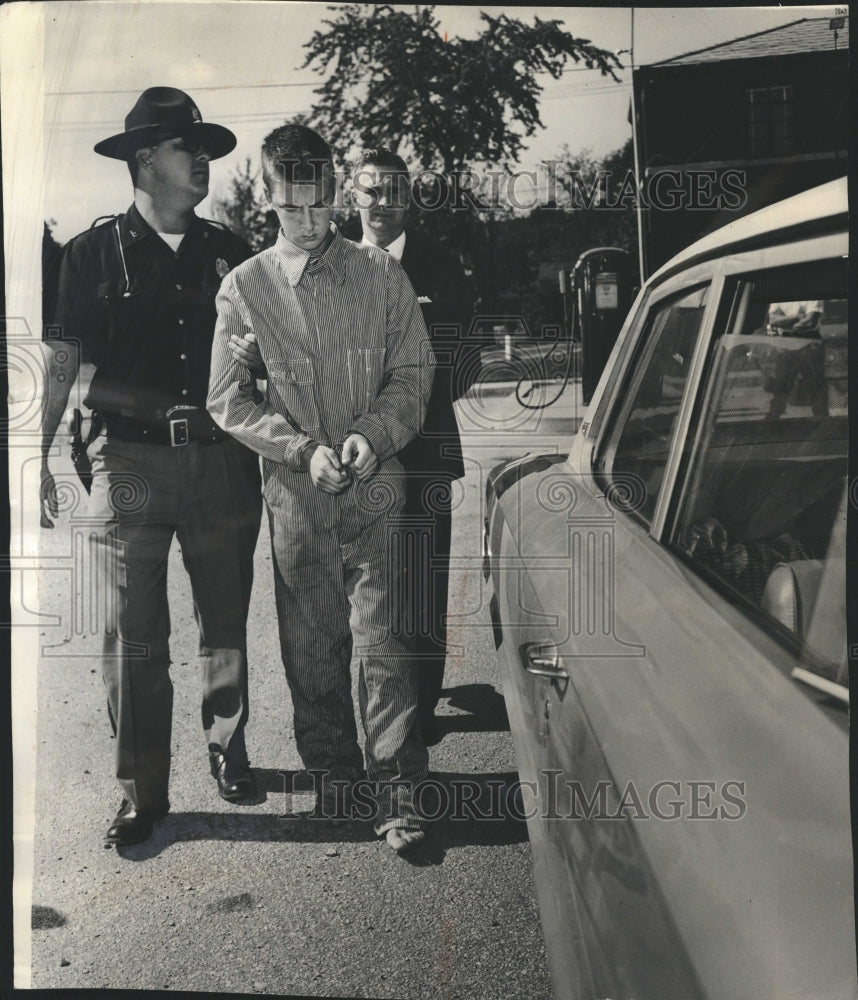 1964 Richard Dobeski is taken to a police car after being captured - Historic Images