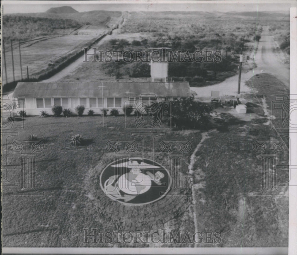 1964 Marine emblem stands inside Guantanamo Gate  - Historic Images