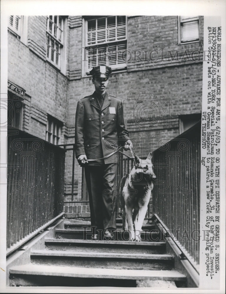 1963Special Patrolman Edmundo Carmelo sets out with a German Shepard - Historic Images