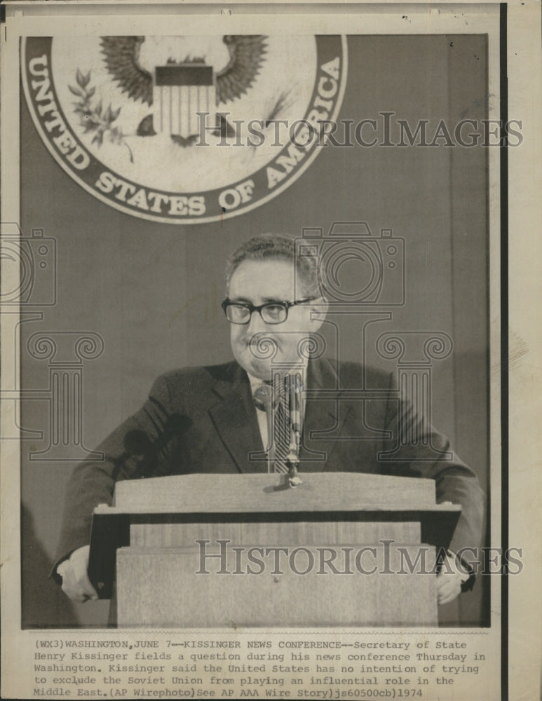 1974 Secretary of Sate Henry Kissinger fields a question during his - Historic Images