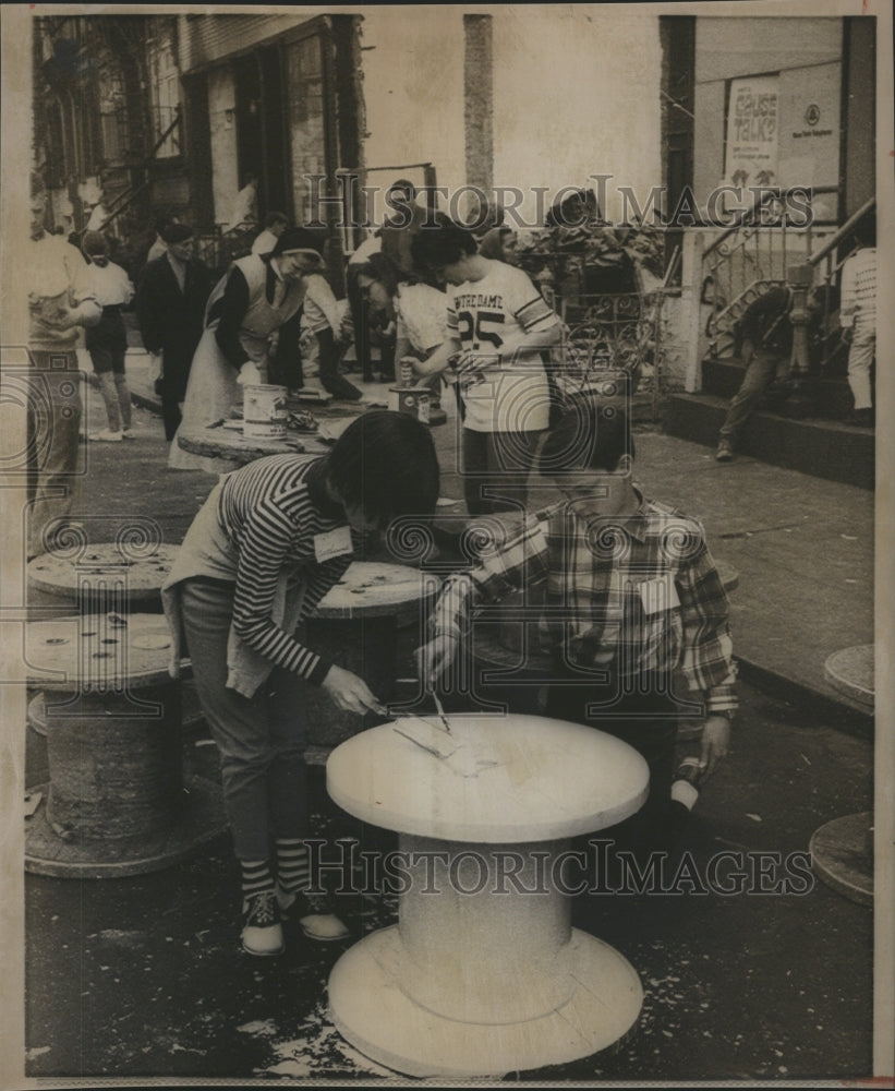 1968 Catherine Bidanset, Mark Zonchelli paint cable spools to help - Historic Images