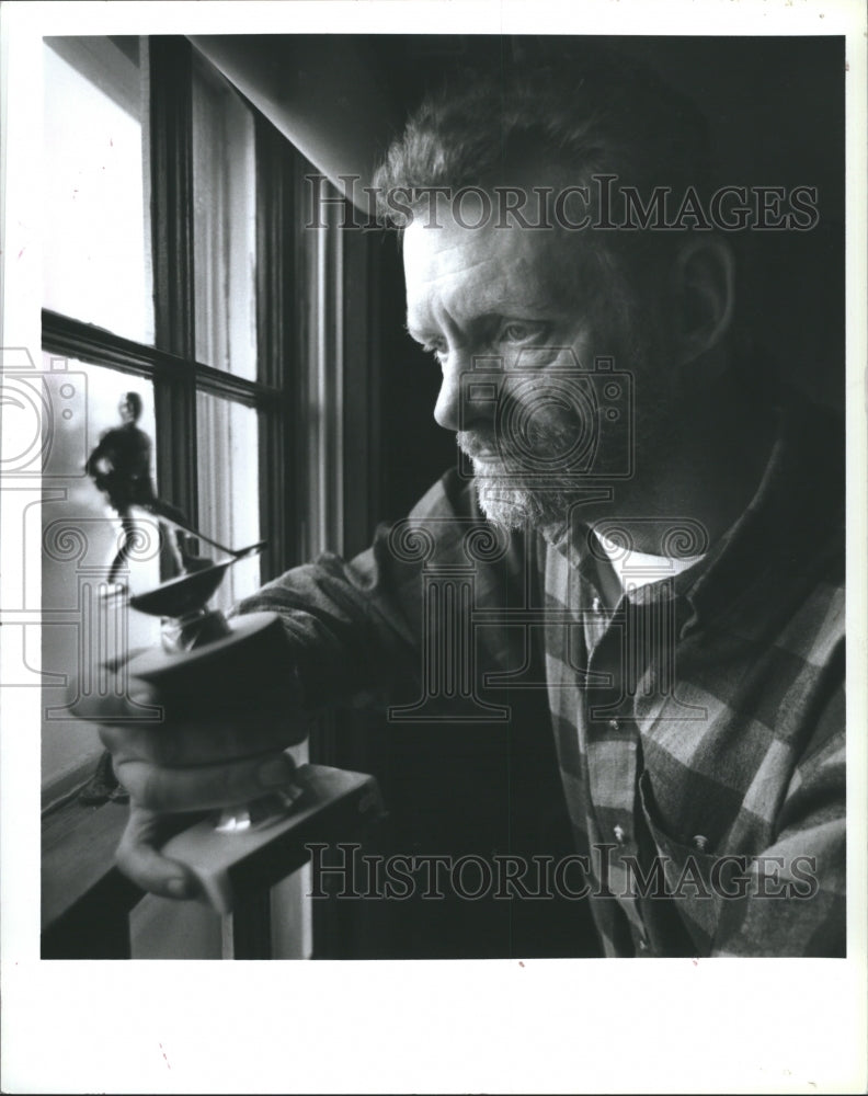 1995 Dennnis Messing holds his son&#39;s hockey trophy, Mark Messing. - Historic Images