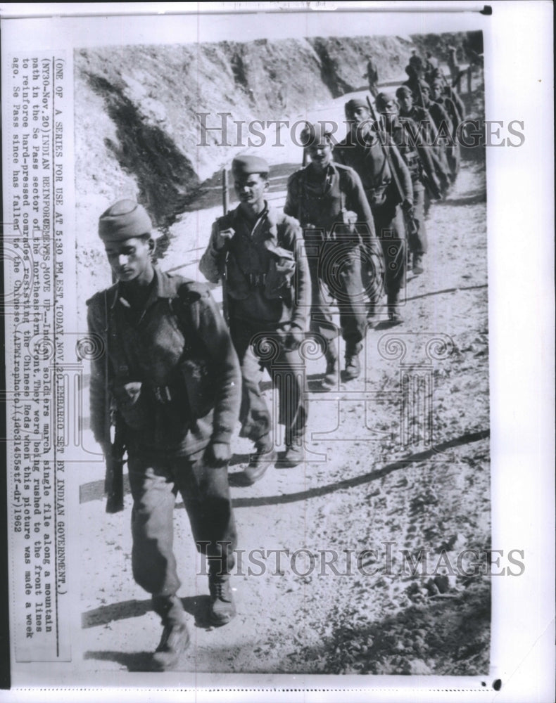 1962 Indian soldiers march along mountain path in the Se Pass sector - Historic Images