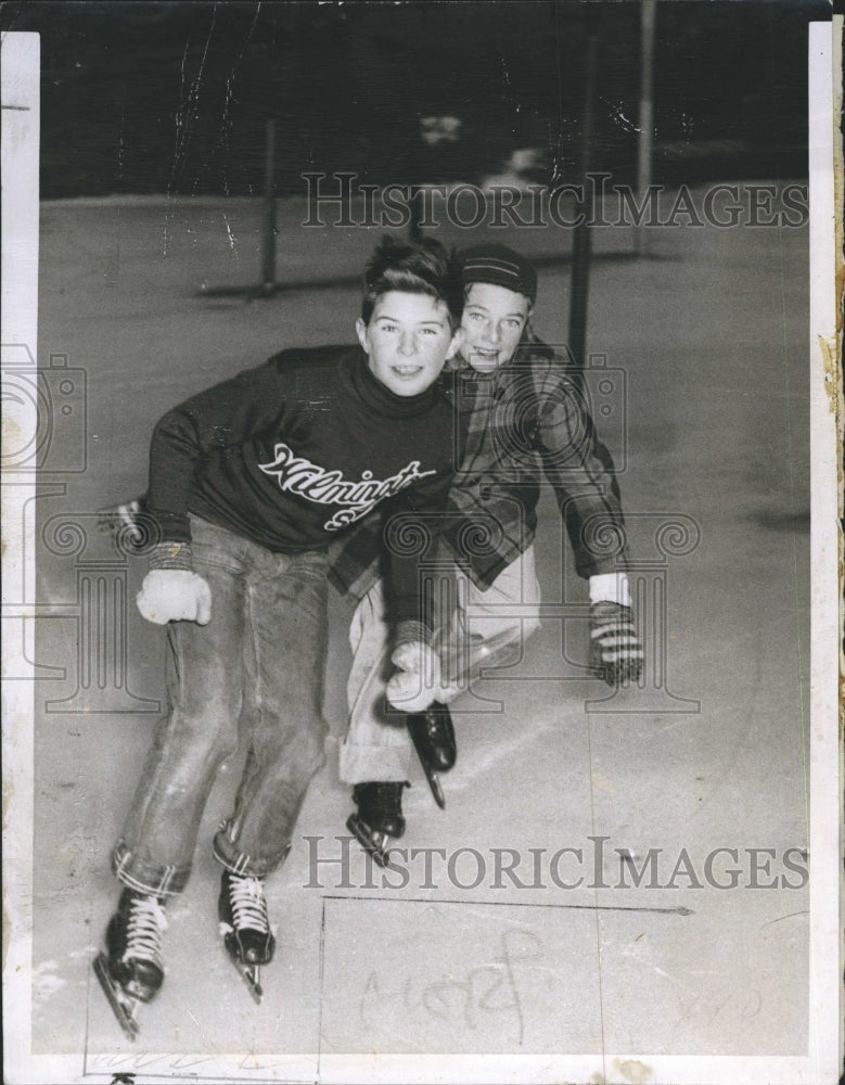 Press Photo Boys ice skating - Historic Images
