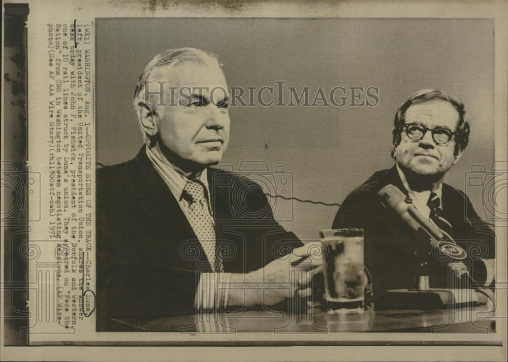 1971 Charles Luna (L) pres. of the UTU shares the answers with - Historic Images