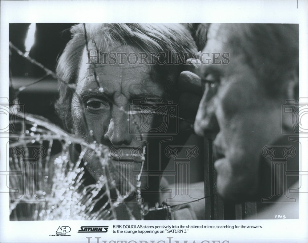 Press Photo Kirk Douglas stares pensively into the shattered mirror, searching - Historic Images