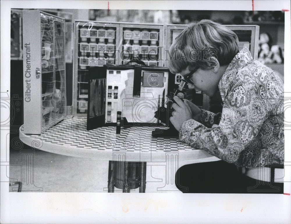 1973 Young boy playing with Gilbert Chemcraft Kit - Historic Images