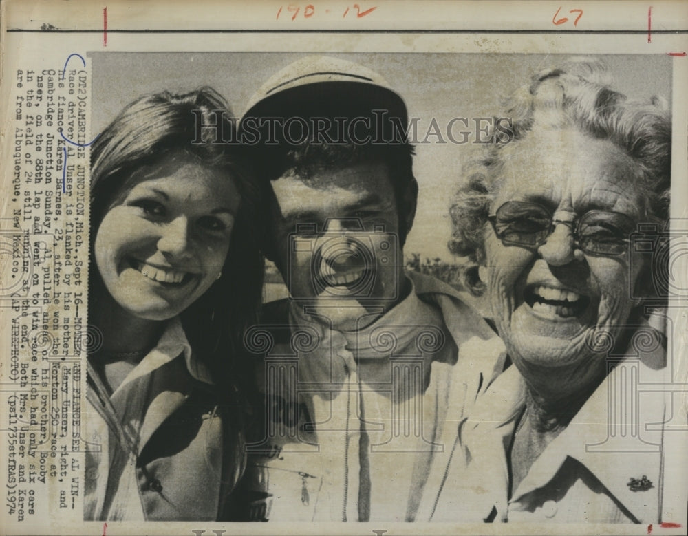 1974 Al Unser flanked by Fiance Karen Barnes,Mother Mary Unser - Historic Images