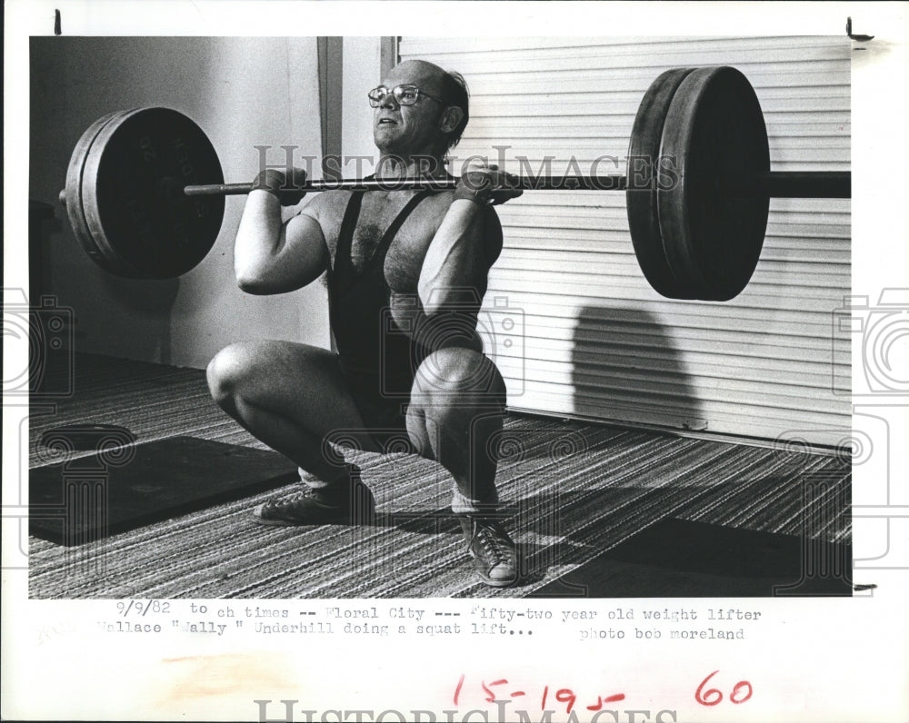 1982 Grandfather Weight lifter, Wally Underhill, does a squat lift - Historic Images