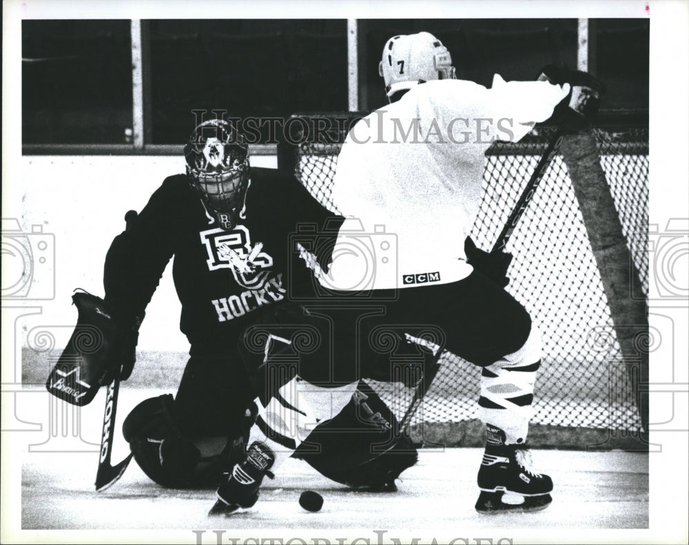 1995 Boston College goalie Greg Taylor blocks Greg Myler  - Historic Images