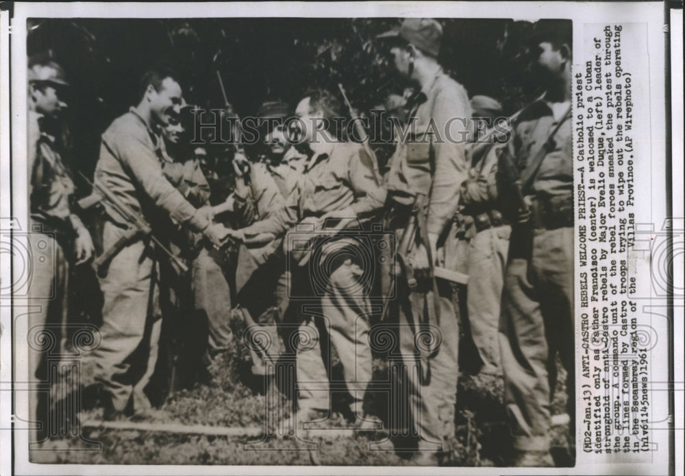 1961 Father Francisco is welcomed to Cuban camp by Maj. Evelio Duque - Historic Images