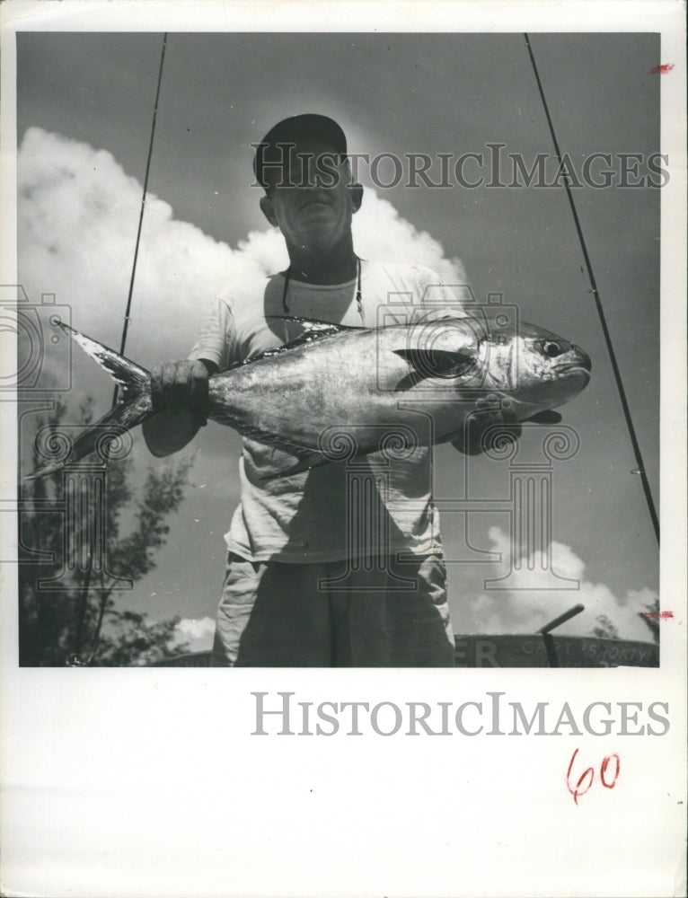 1962 Fisherman displays a large fish - Historic Images