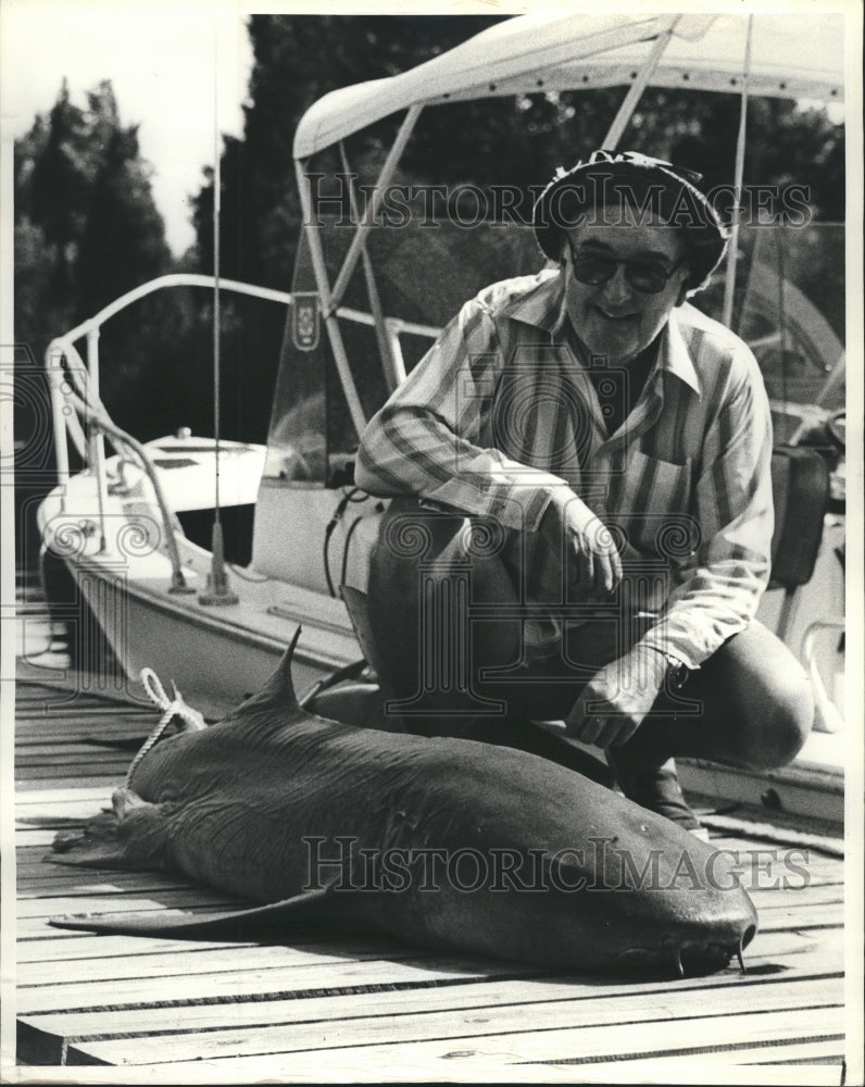 1980 Pat Fleming displays 185-pound nurse shark he caught in first - Historic Images