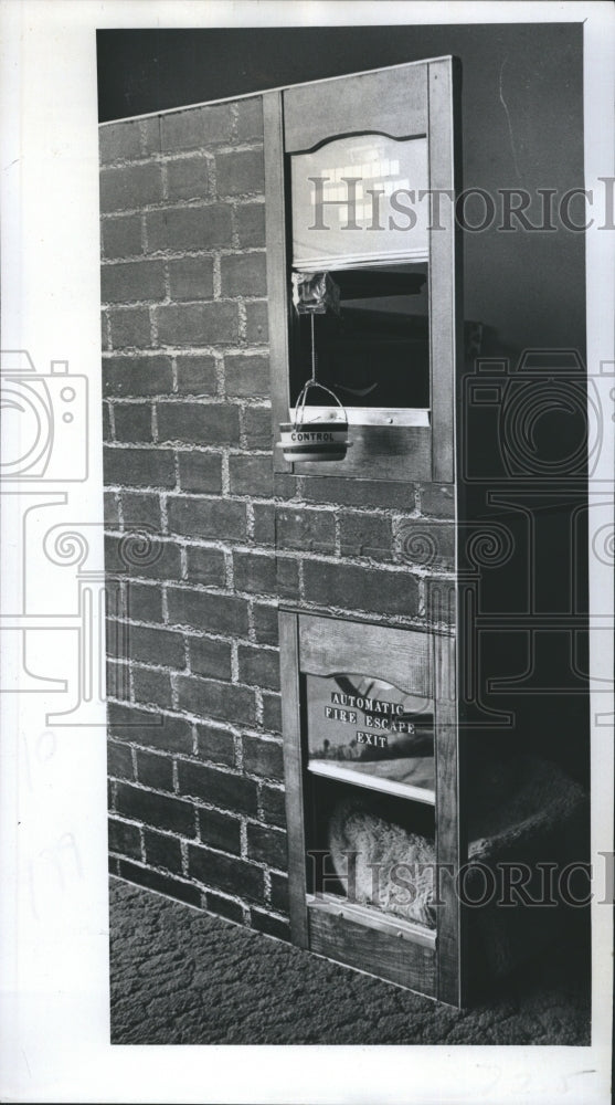 1973 This bucket would lower people to the ground  - Historic Images