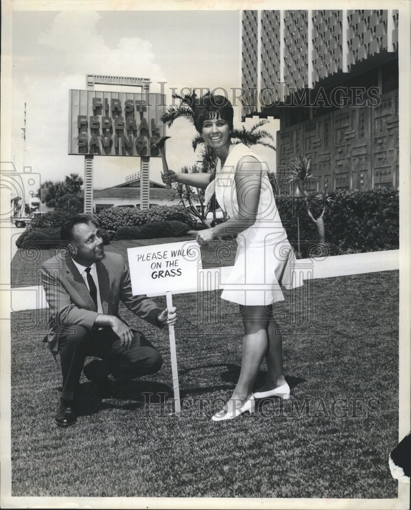 1969 Bill Paralow and Cindy Matson stand on new artificial grass - Historic Images